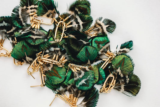 St Armands Designs of Sarasota mallard feather tassel earrings with gold hooks showcasing delicate feather details and tassel accents.