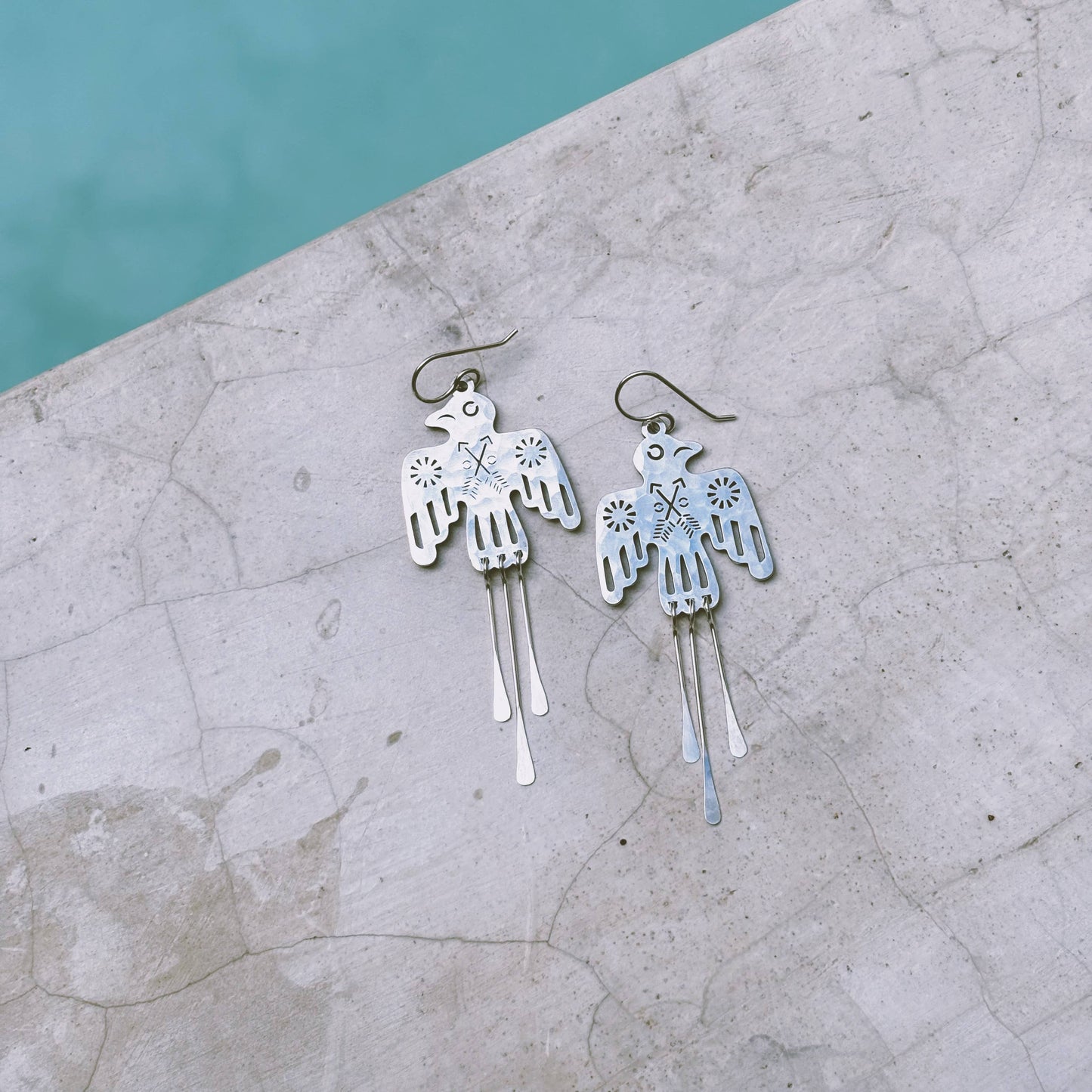 Fluff Hardware Glide Earrings featuring sleek, modern design with smooth metal finish and minimalist style.