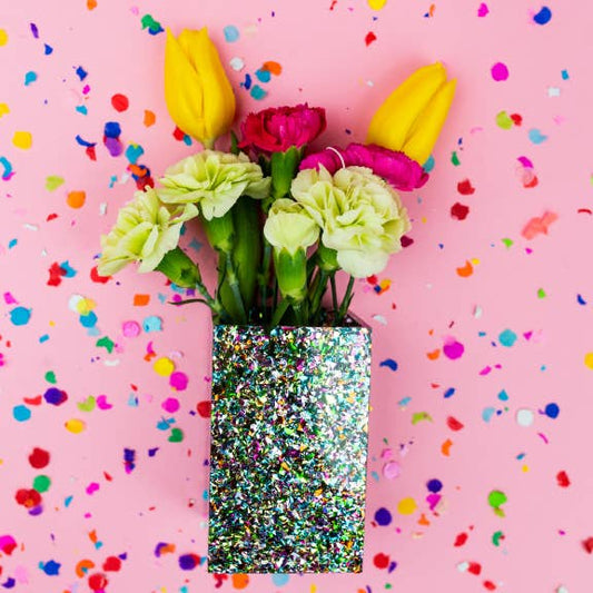 Colorful confetti Taylor Elliott Designs pencil and pen cup with vibrant design, holding pens and pencils on a desk.
