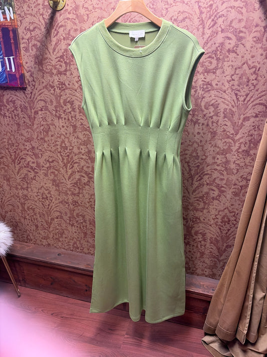Entro Matcha Dress displayed on a hanger, featuring a flowy fabric and stylish design suitable for casual or semi-formal wear.