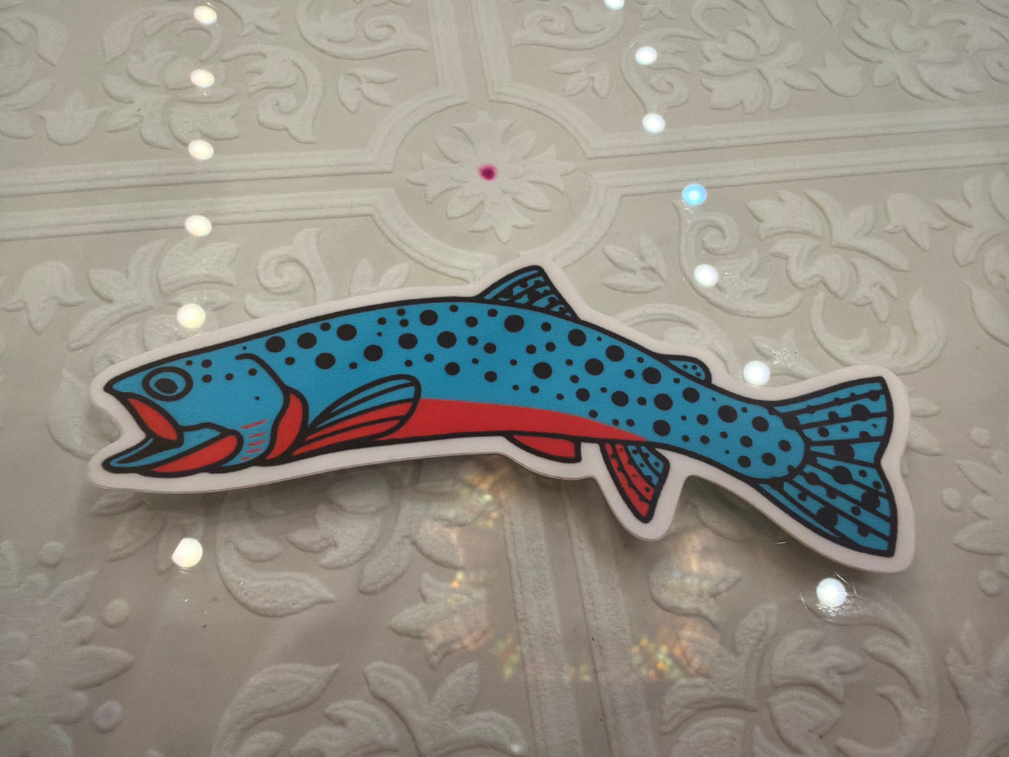 Colorful Westslope Cutthroat Trout sticker by Field Guide Designs, showcasing detailed fish illustration on a white background.