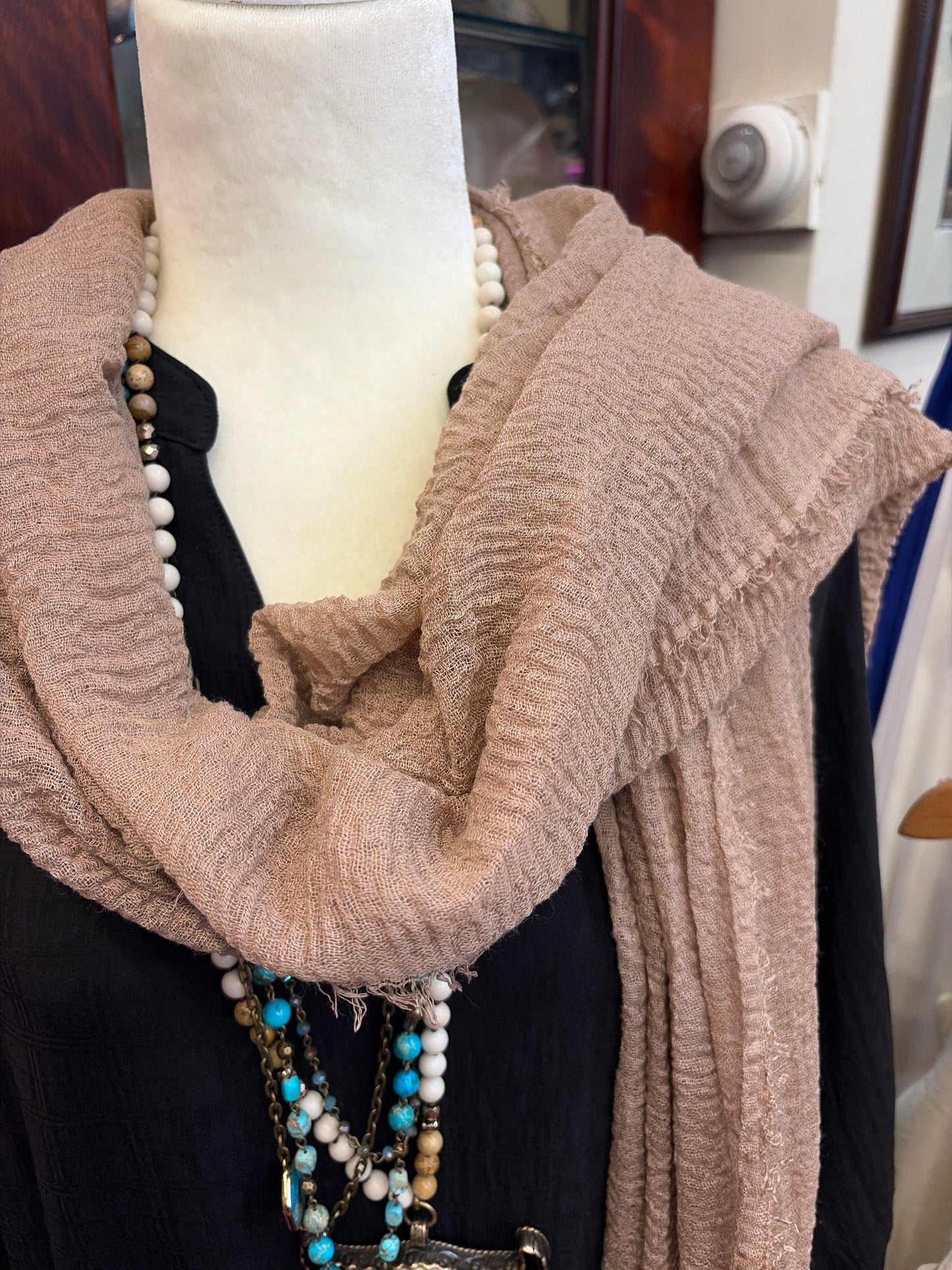 Joia tissue scarf featuring lightweight, soft fabric with a delicate pattern, perfect for stylish accessorizing.