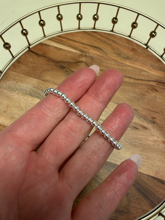Sterling silver beaded bracelet by Lula 'n' Lee with round silver beads, displayed on a neutral background.