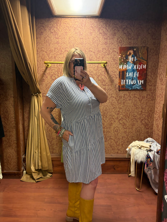 Camille & Co. striped ticking dress featuring a fitted bodice and flowing skirt, perfect for casual or semi-formal occasions.