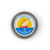 Swedish Dream Lemon Lip Balm by Kalastyle Soap Co. shown in a closed lip balm tube with lemon-themed packaging.