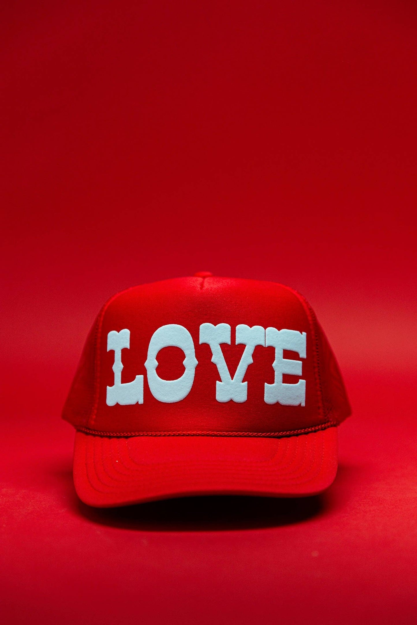 Ascot + Hart Big Love Trucker hat featuring a structured cap with a front logo patch and adjustable snapback closure.