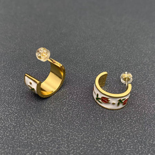Mio Queena enamel tulip earrings featuring vibrant floral design and gold-tone accents, hanging from delicate hooks.