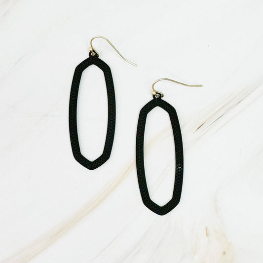 Ellison+Young Shape Of Game earrings featuring geometric, abstract design in gold-tone metal on a white background.