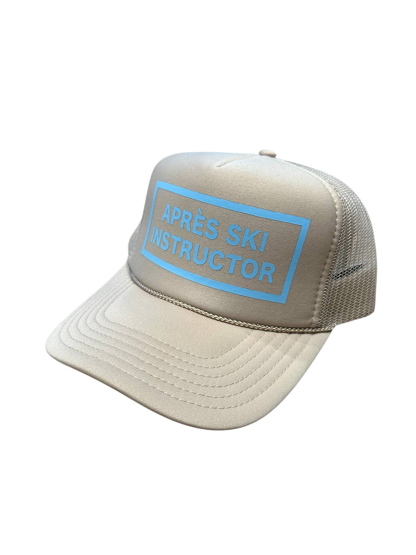Après Babe Après Ski instructor trucker hat with embroidered logo, mesh back, and adjustable snap closure.