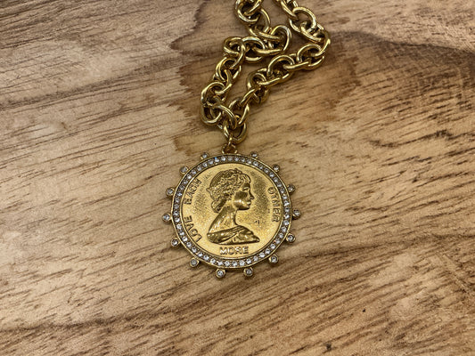 Small coin necklace by CHANSUTTPEARLS featuring delicate metal coins on a fine chain, styled for elegant everyday wear.
