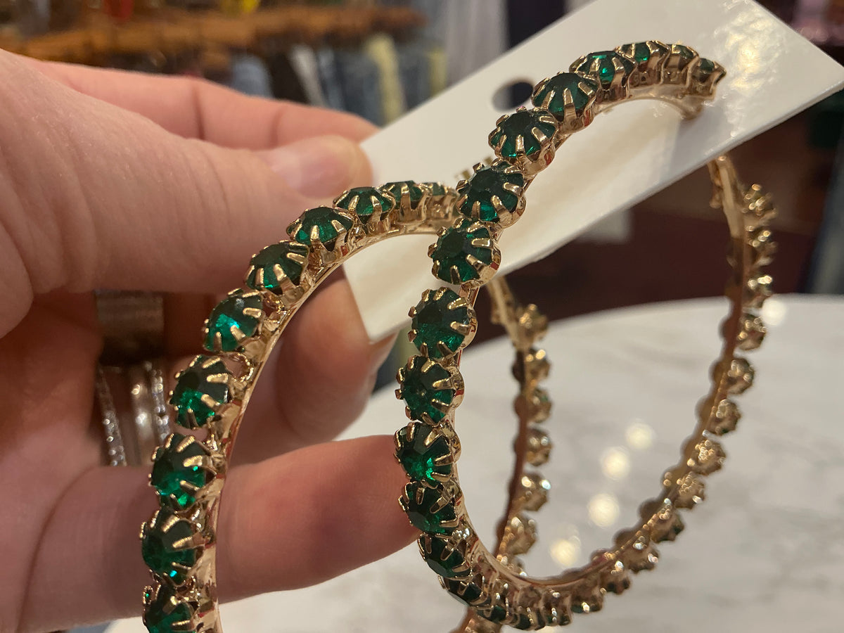 Gold hoop earrings with green crystals from Queen Gypsy featuring a stylish, elegant design.
