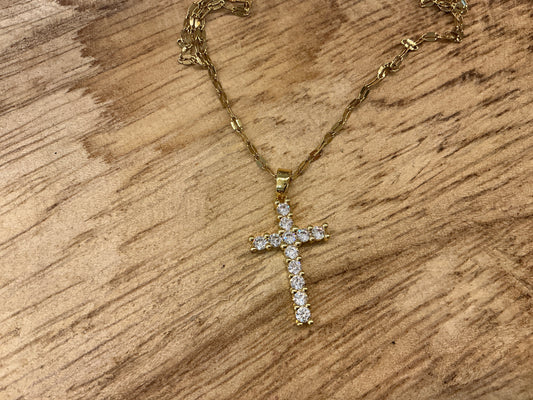 Dainty sparkle cross necklace by CHANSUTTPEARLS featuring a silver chain and shimmering cross pendant on a white background