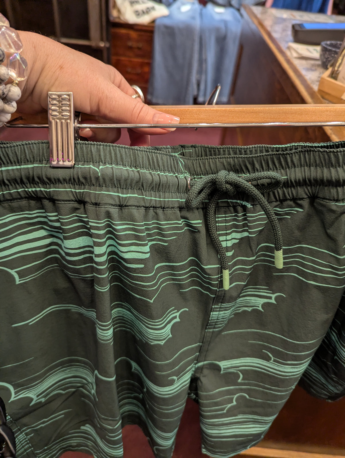 Tori Richards In the Clouds swimshorts with a blue cloud pattern, lightweight fabric, and elastic waistband for comfortable beachwear.