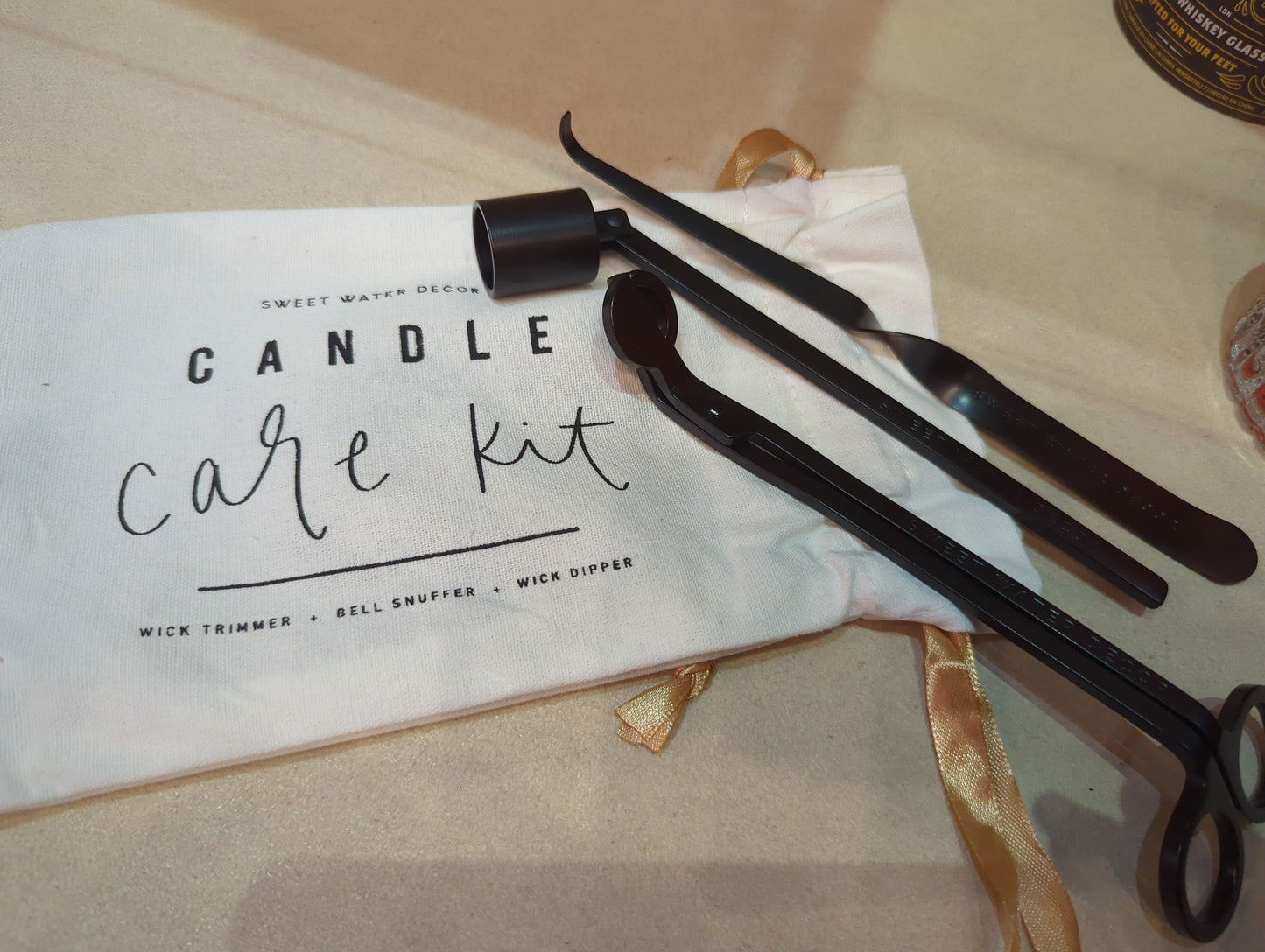 Black Candle Care Kit with candles and accessories from Sweet Water Decor, featuring black candles and maintenance tools.