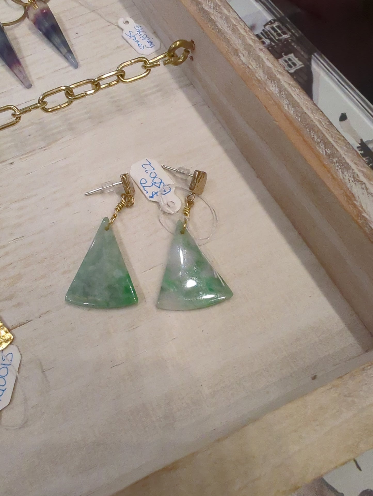 Burma Jade triangle post earrings by Skipping Stones Jewelry featuring smooth green jade stones on silver posts