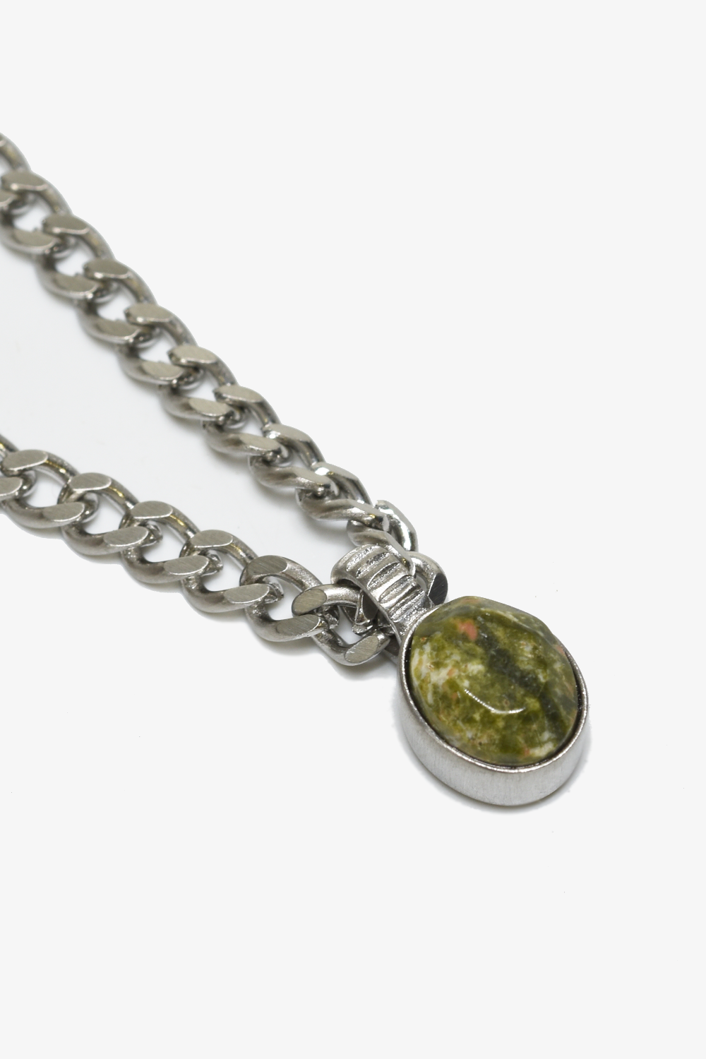 Unakite pendant necklace featuring a polished green and pink stone on a delicate chain, by Curated Basics.