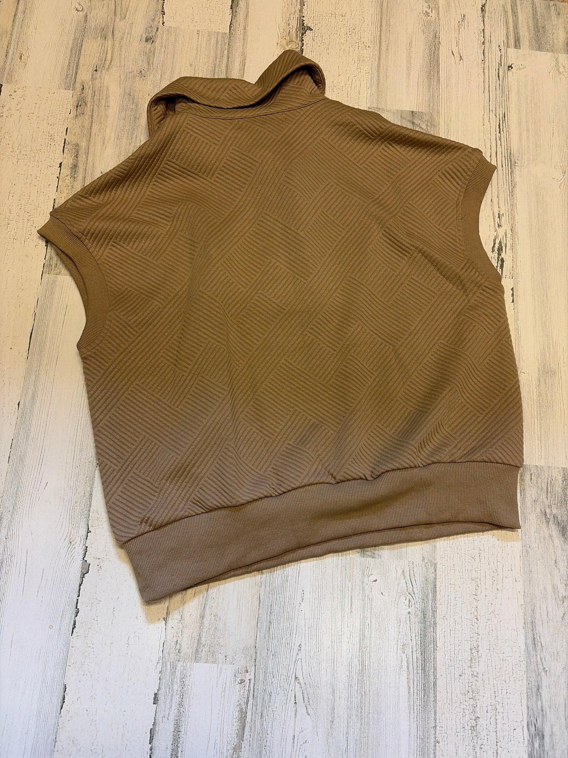 Miss B Pixy & Ivy textured half zip top, close-up of the light-colored, soft fabric with a half zipper and subtle textured pattern.