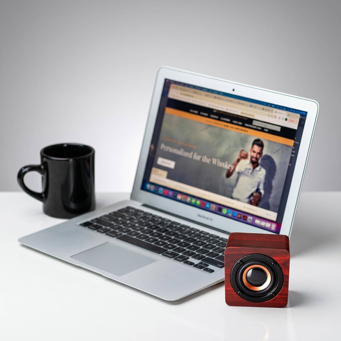 Cherrywood Bluetooth speaker by HomeWetBar with sleek design and control buttons visible on the front.