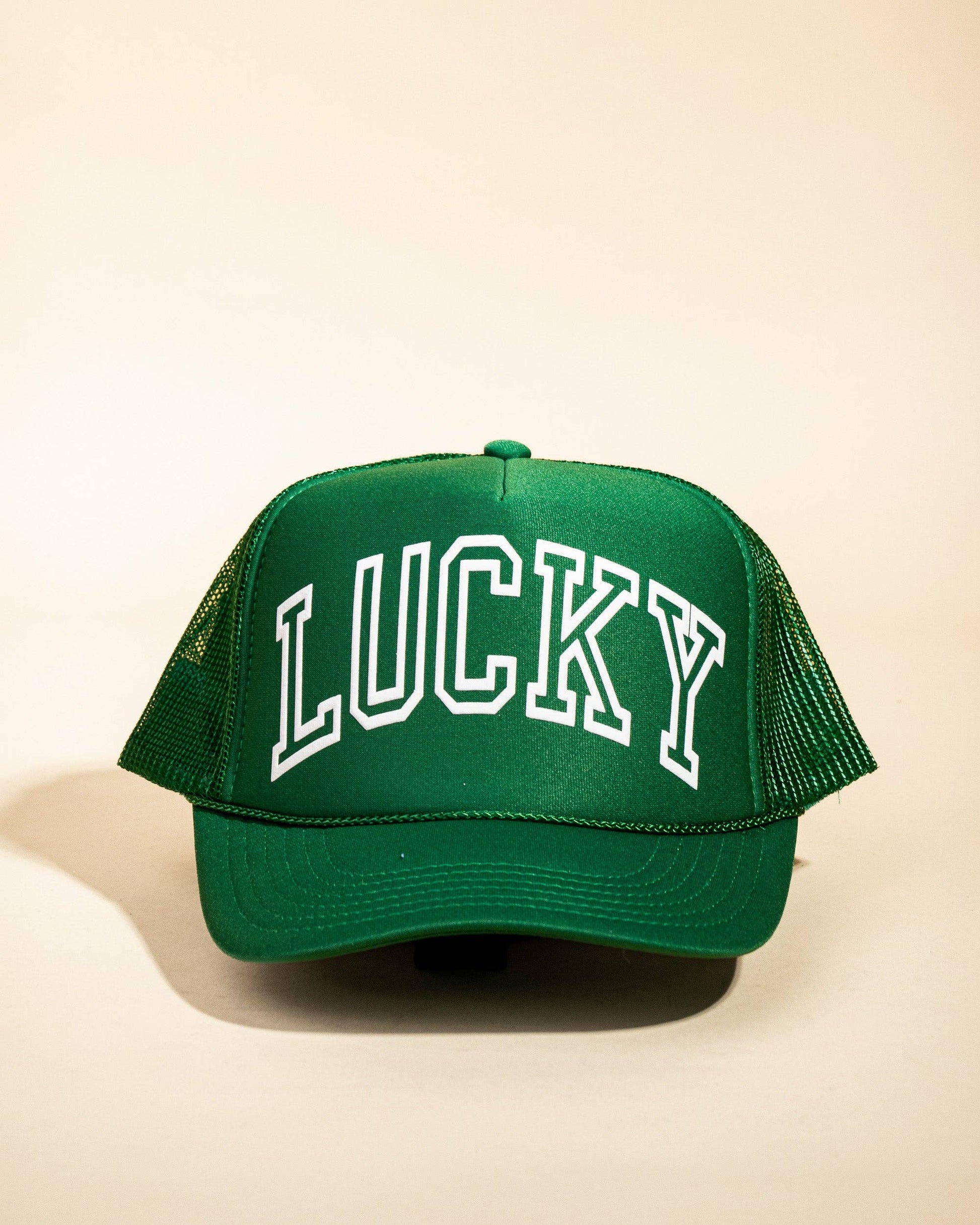 Ascot + Hart Lucky Trucker hat with adjustable strap and embroidered logo, casual outdoors style.