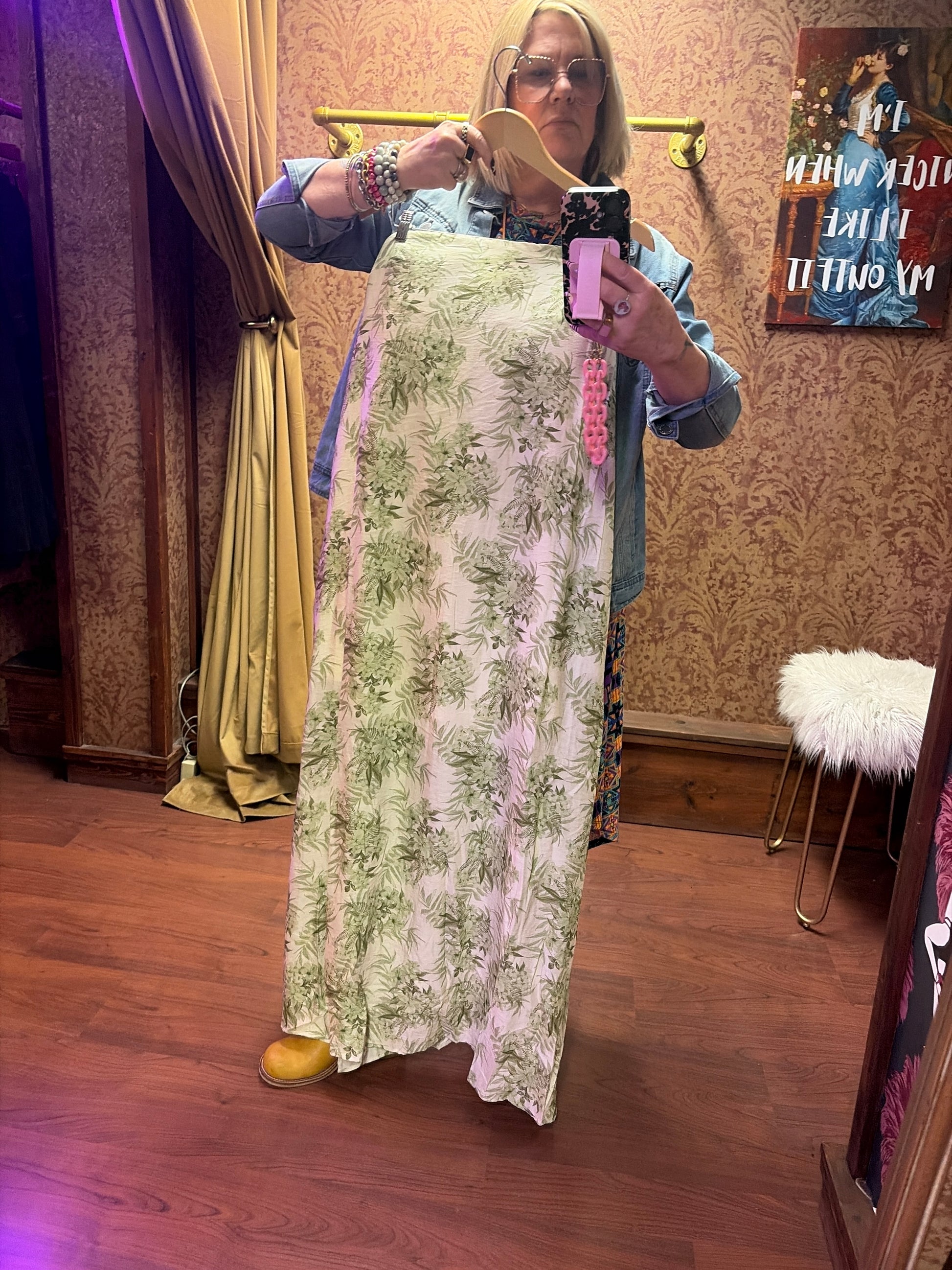 Princess & Buck Fern Gully Dress displayed on a hanger, featuring a flowy fabric and vibrant fern print perfect for summer wear.