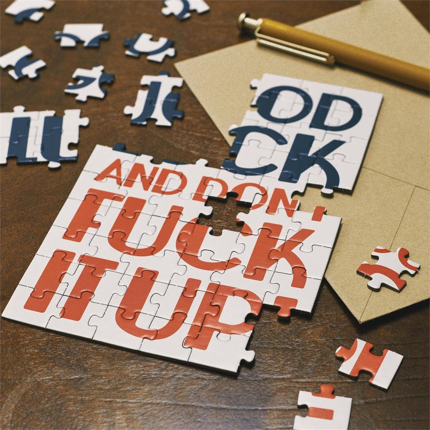 Questionables Good Luck Puzzle Card featuring a colorful, intricate puzzle design on a greeting card for good luck wishes.