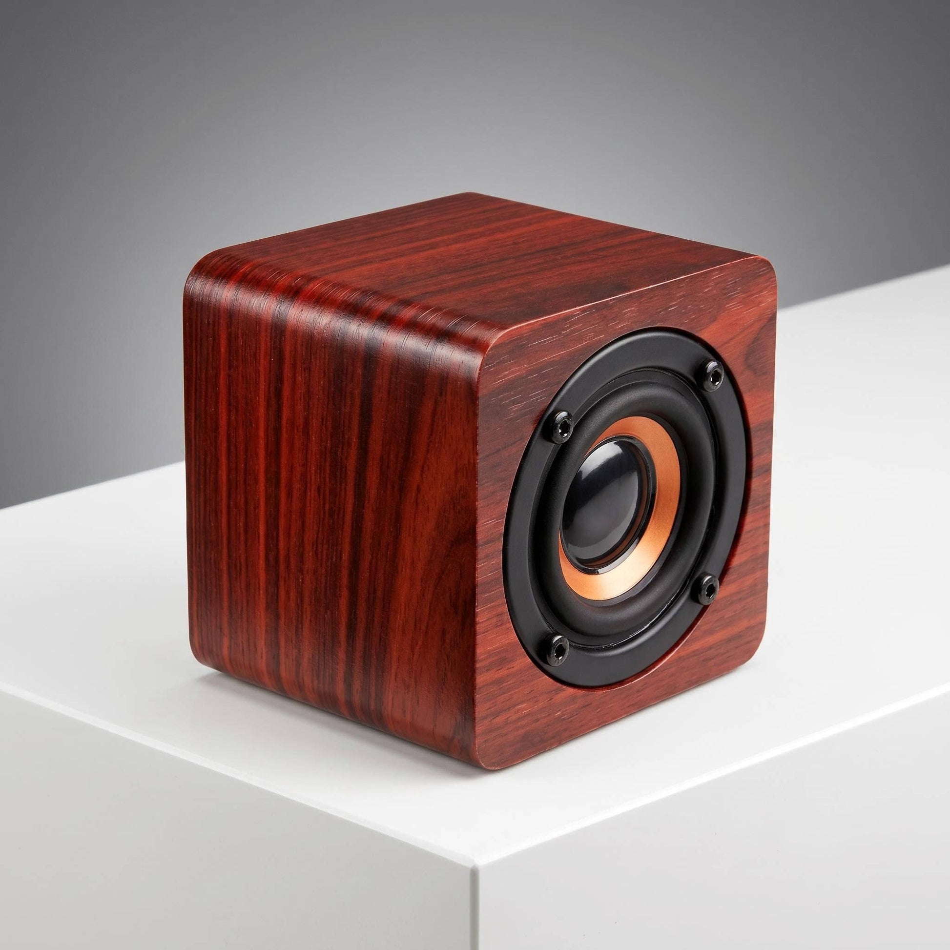 Cherrywood Bluetooth speaker by HomeWetBar, showing a stylish wooden portable Bluetooth speaker with control buttons.