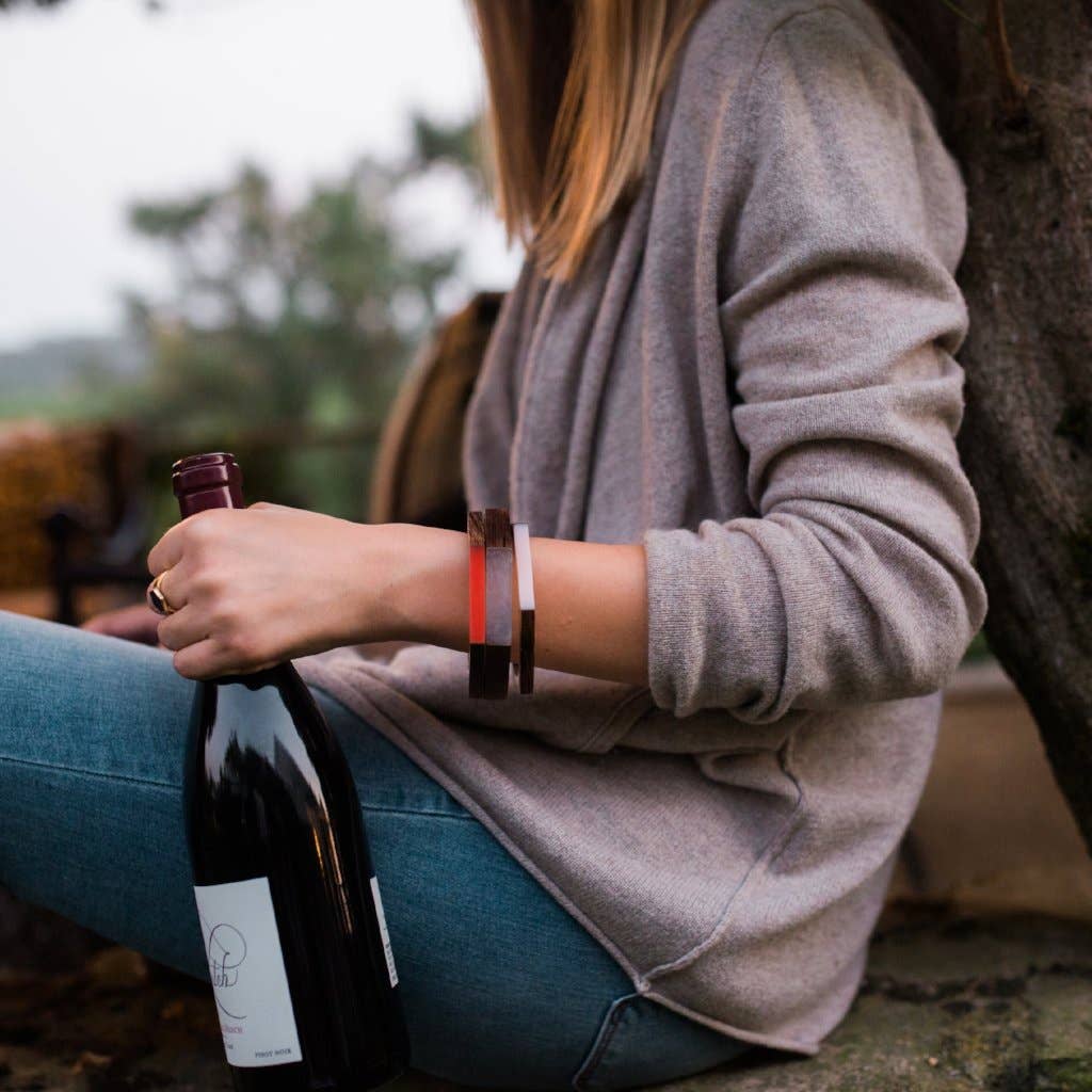 Olive and Poppy 1/2-inch barrel bracelet featuring sleek, polished metal design on a neutral background.