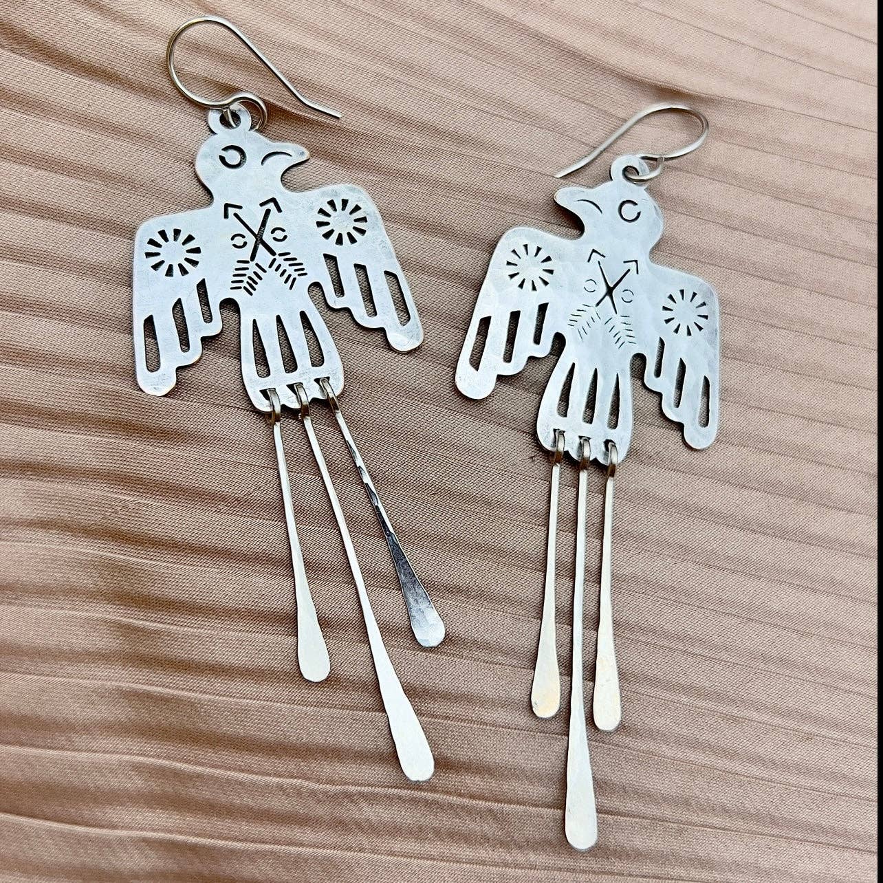 Silver Glide Earrings by Fluff Hardware featuring sleek, minimalist design with polished finish and delicate hooks.