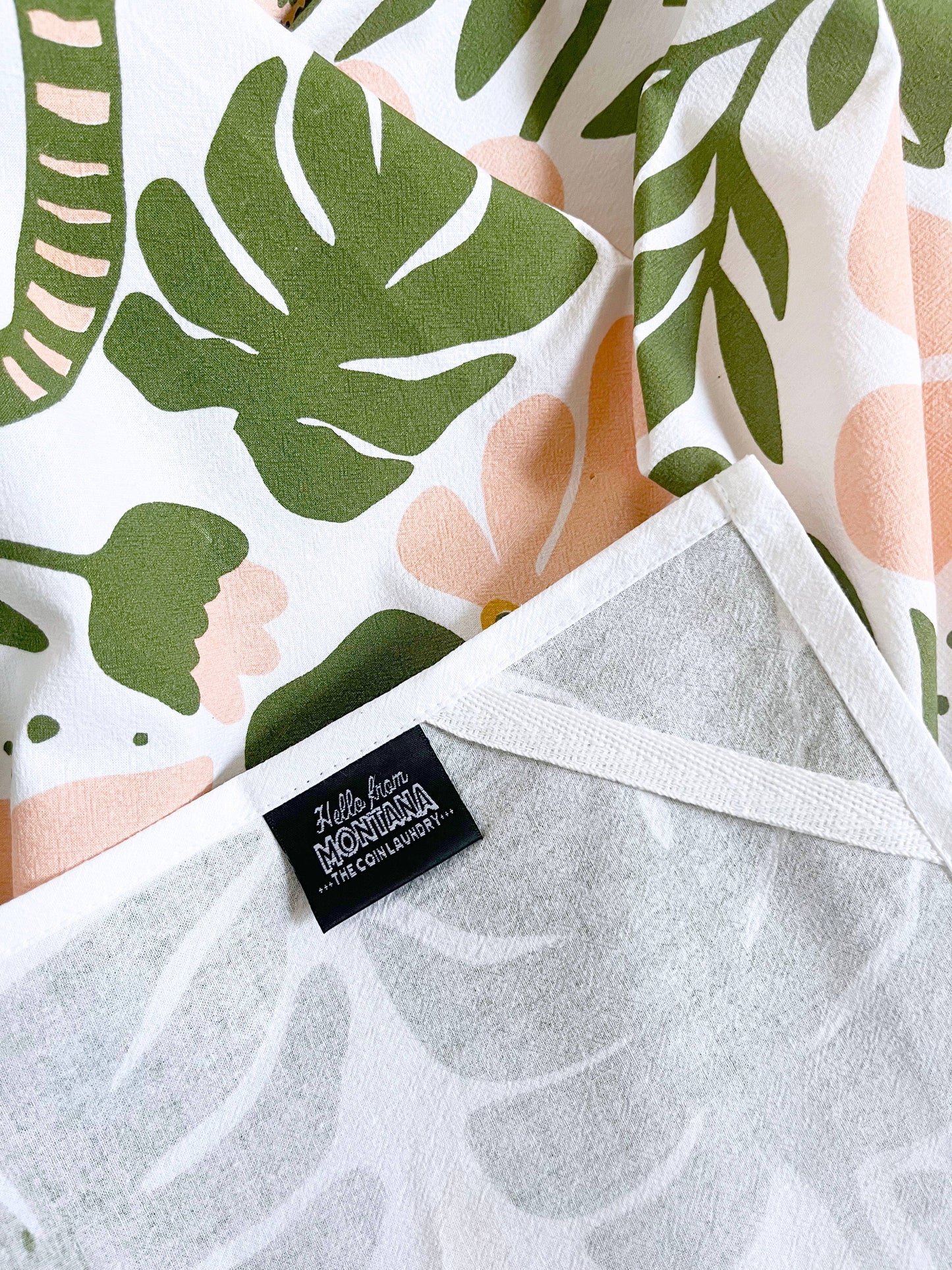 Tiger floral tea towel from The Coin Laundry featuring modern boho pink and green flower design, perfect for kitchen decor.
