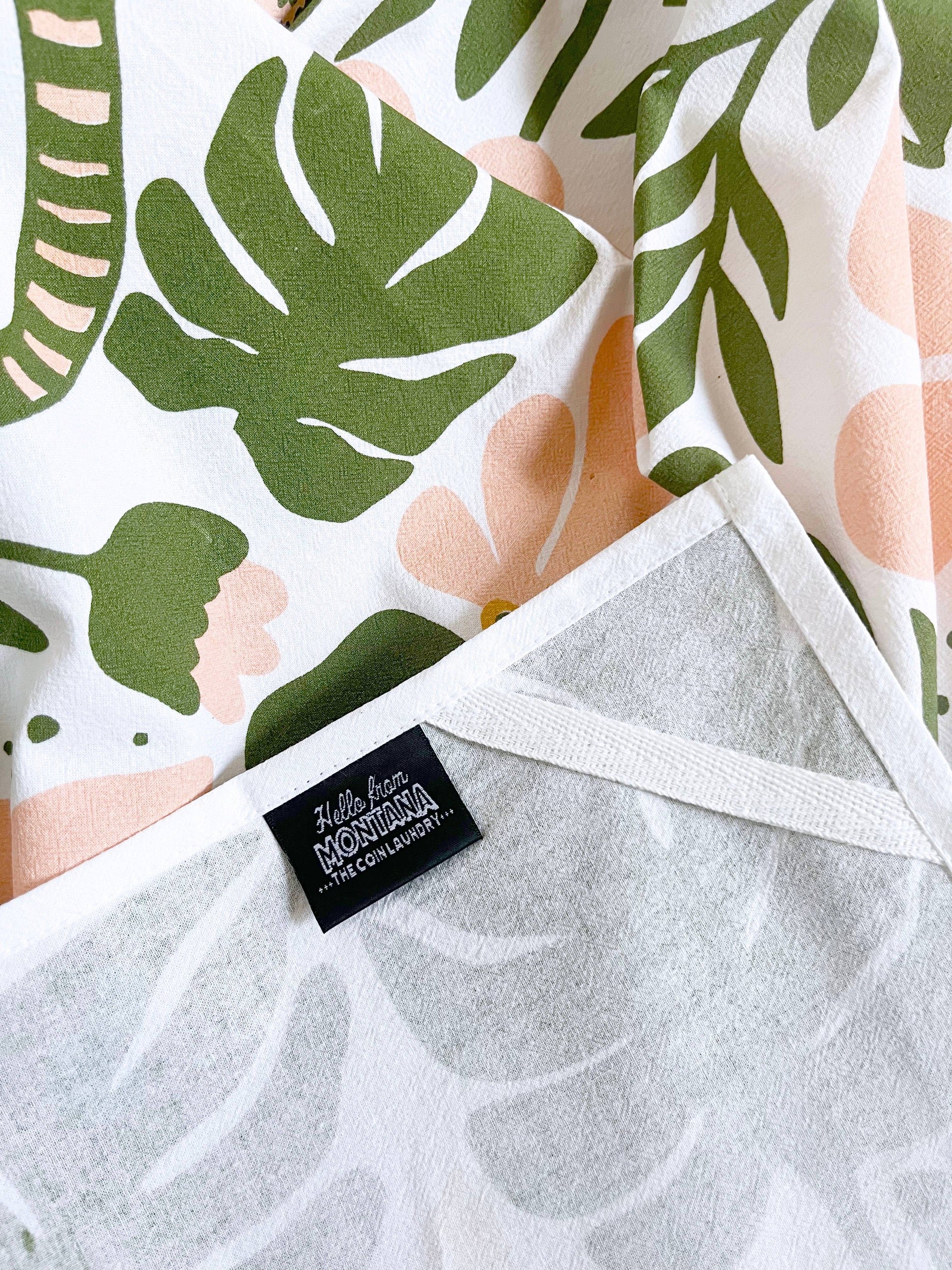 Tiger floral tea towel from The Coin Laundry featuring modern boho pink and green flower design, perfect for kitchen decor.