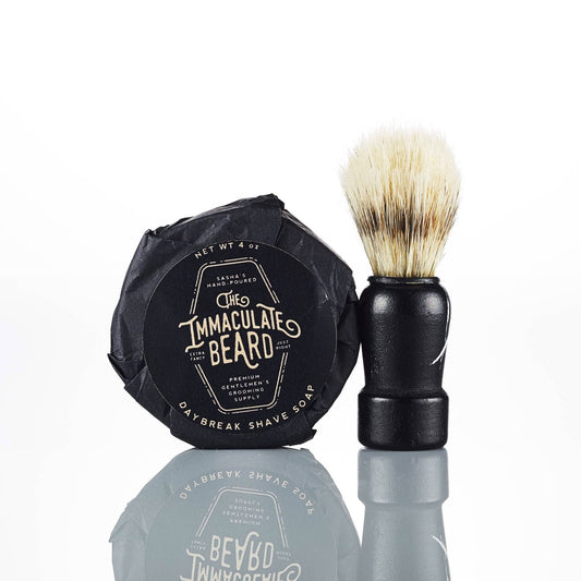 The Immaculate Beard shave soap puck with a smooth, round soap surface in a simple container, ready for shaving.