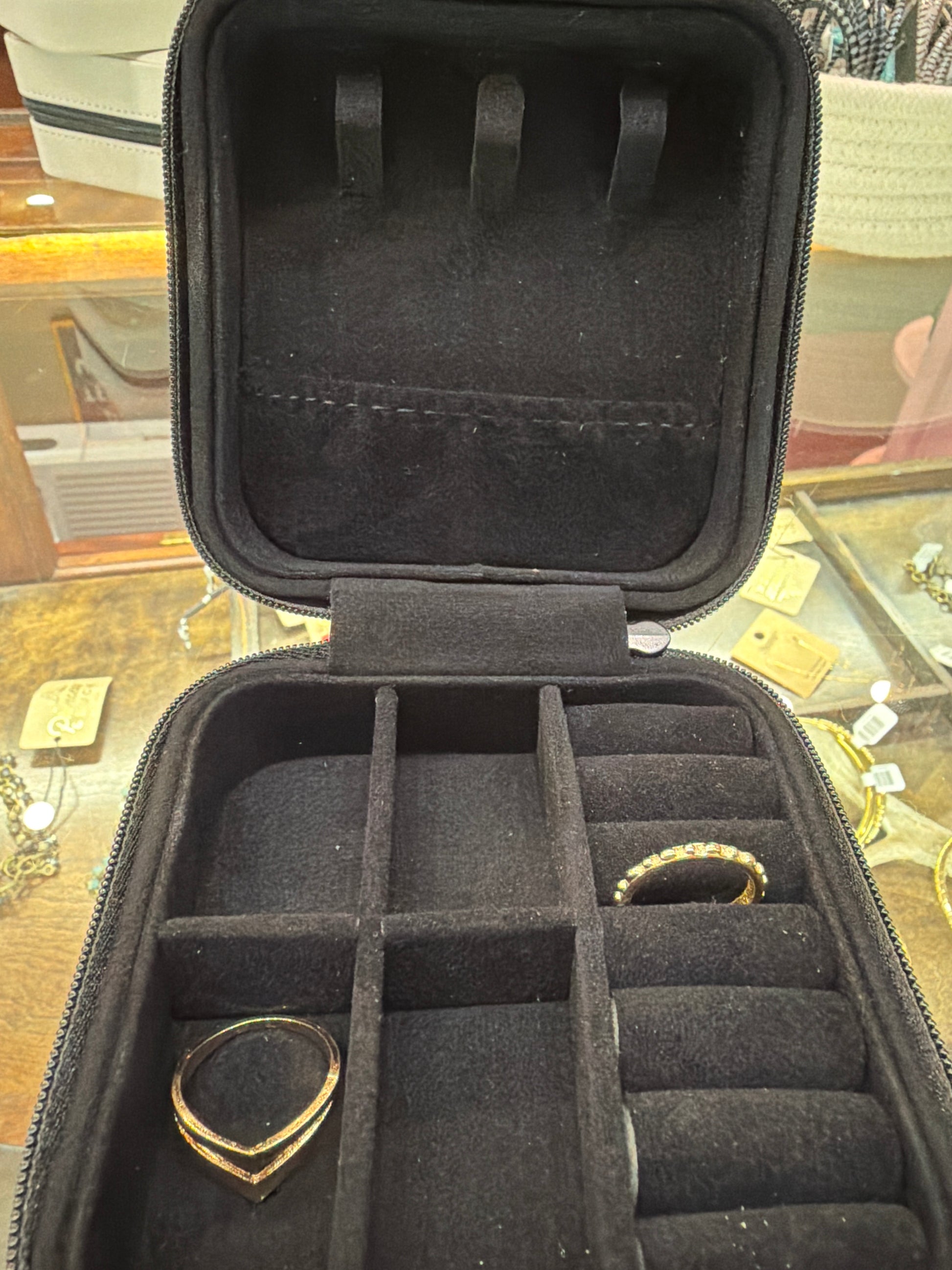 Leatherette jewelry box by Princess & Buck with multiple compartments and a polished finish, perfect for organizing jewelry.
