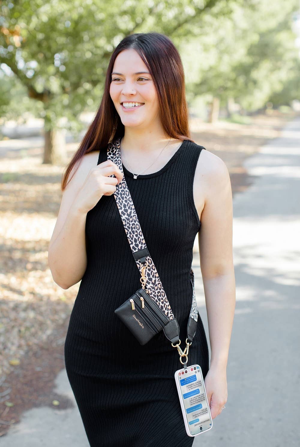 Save The Girls Clip & Go Crossbody Strap with zippered pouch for phones, featuring a stylish and practical design.