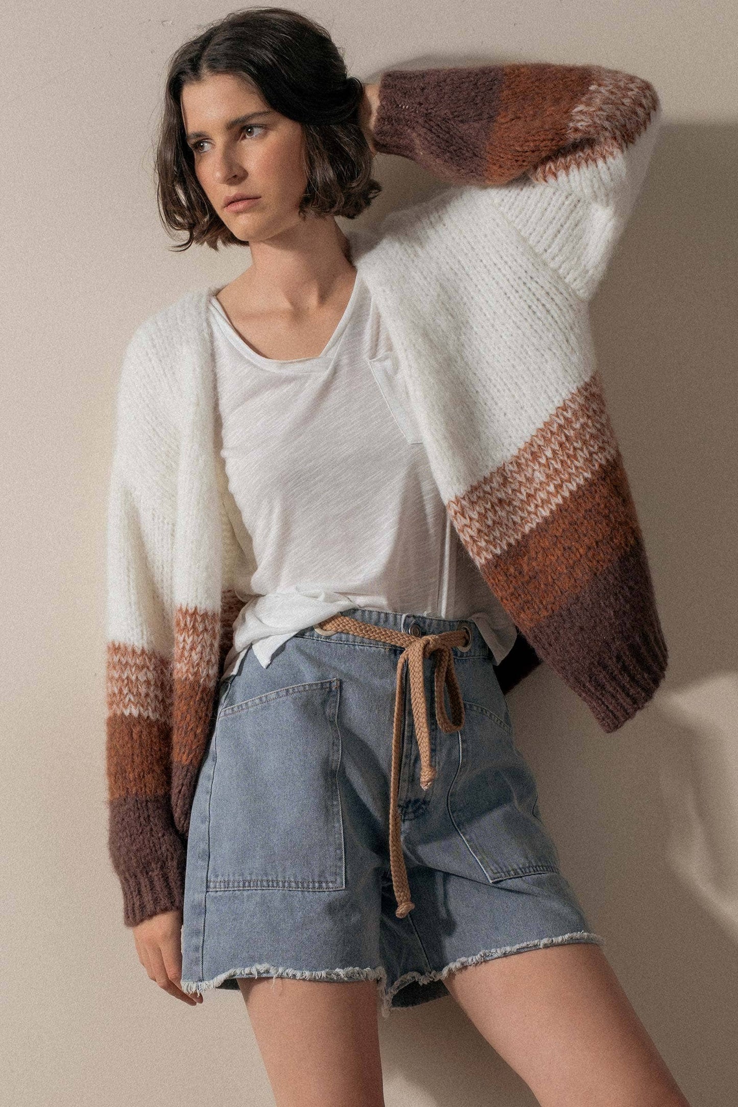 Urban Daizy high-waisted denim shorts with frayed hems, showcasing a stylish casual summer look.