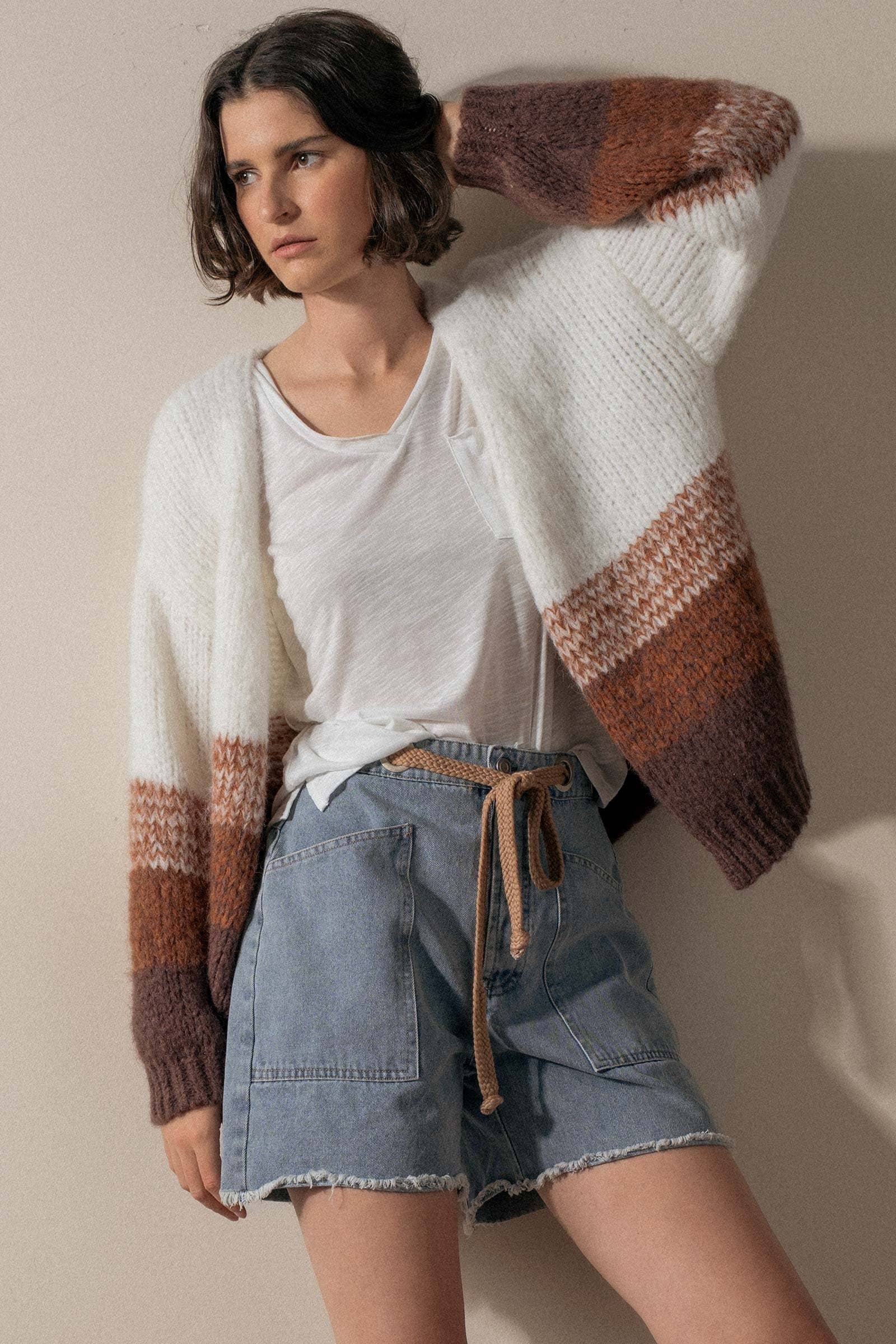 Urban Daizy high-waisted denim shorts with frayed hems, showcasing a stylish casual summer look.