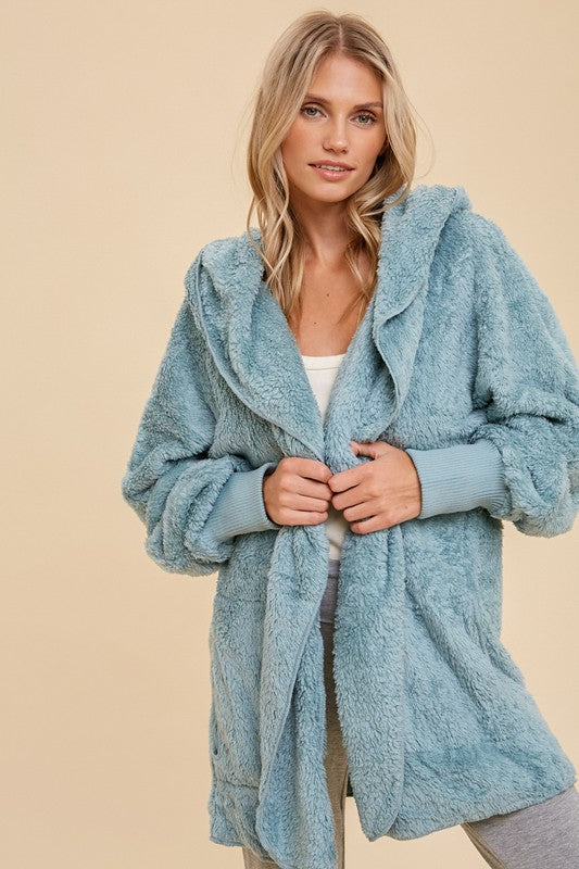 Women’s teddy bear coat by A Sparkling Mess, cozy outerwear with plush, textured fabric, perfect for cold weather.