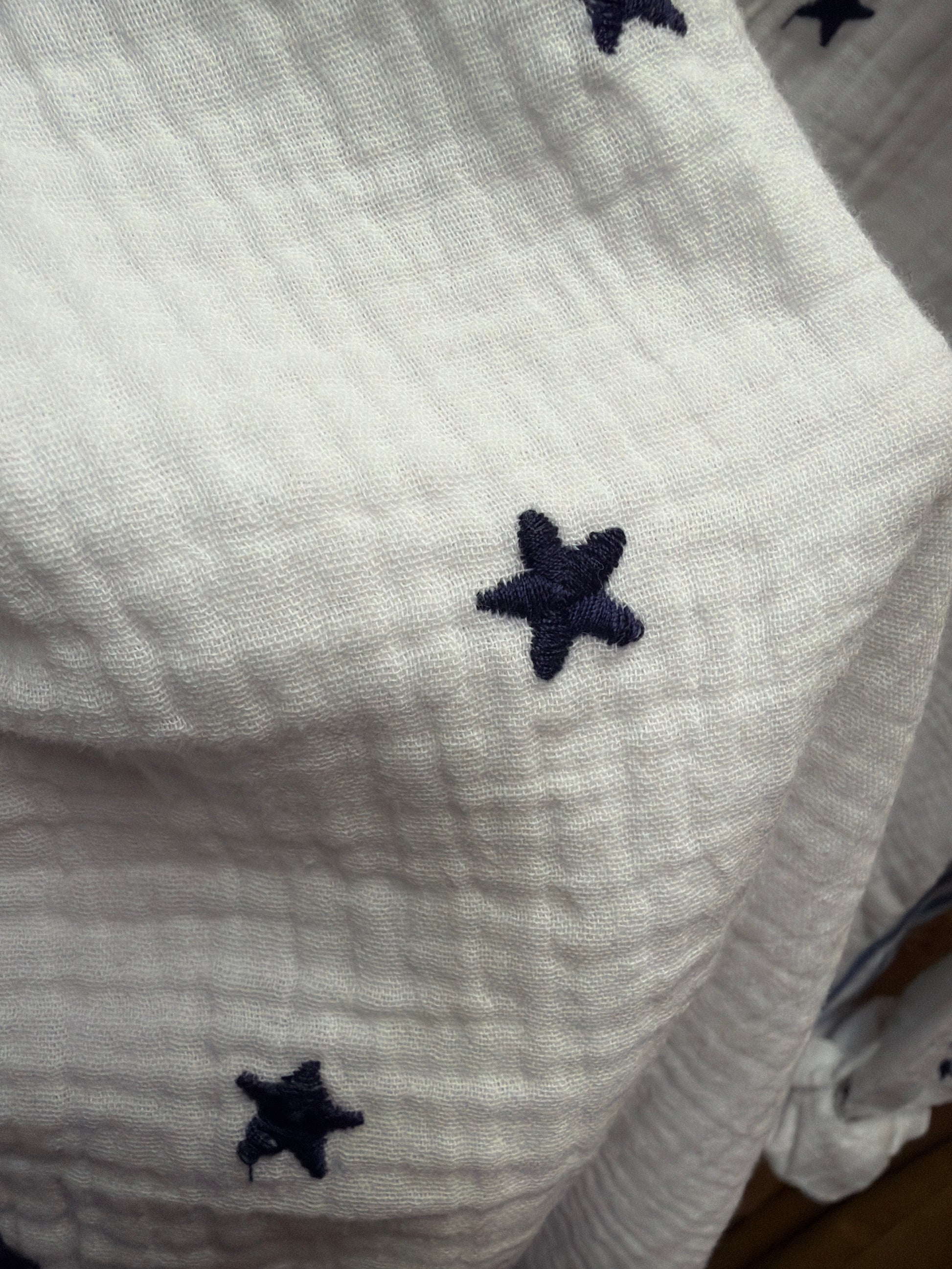 Camille & Co. Reach for the Stars blouse featuring a celestial star print, long sleeves, and a relaxed fit.