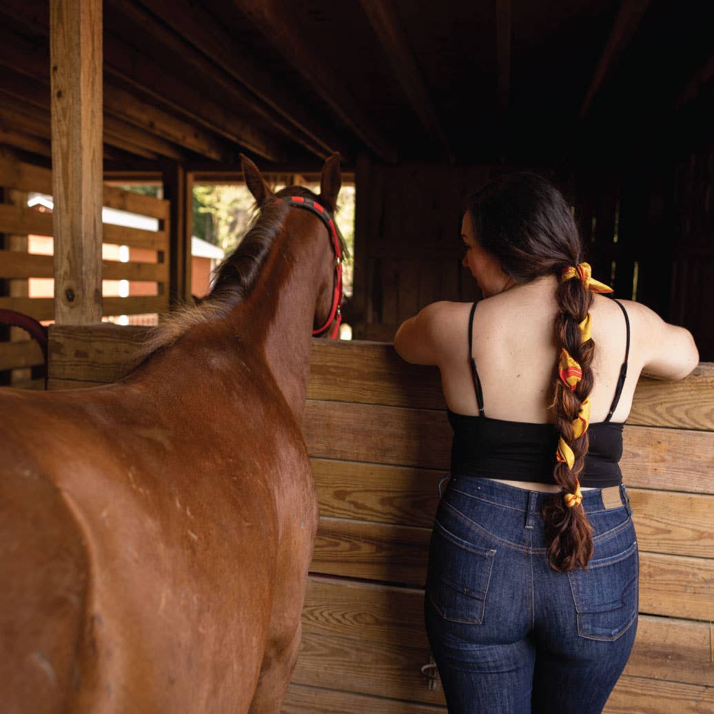 Jenni Earle Buck Up Buckaroo silk bandana with a colorful Western-inspired design, featuring intricate patterns and vibrant colors.