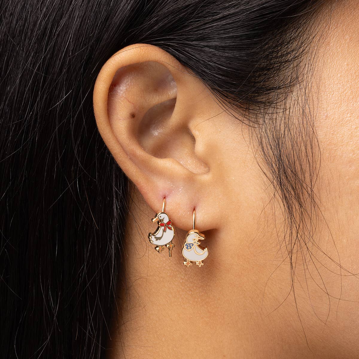 Yellow Owl Workshop duck earrings featuring cute, detailed duck designs on silver-colored hooks for playful accessories.