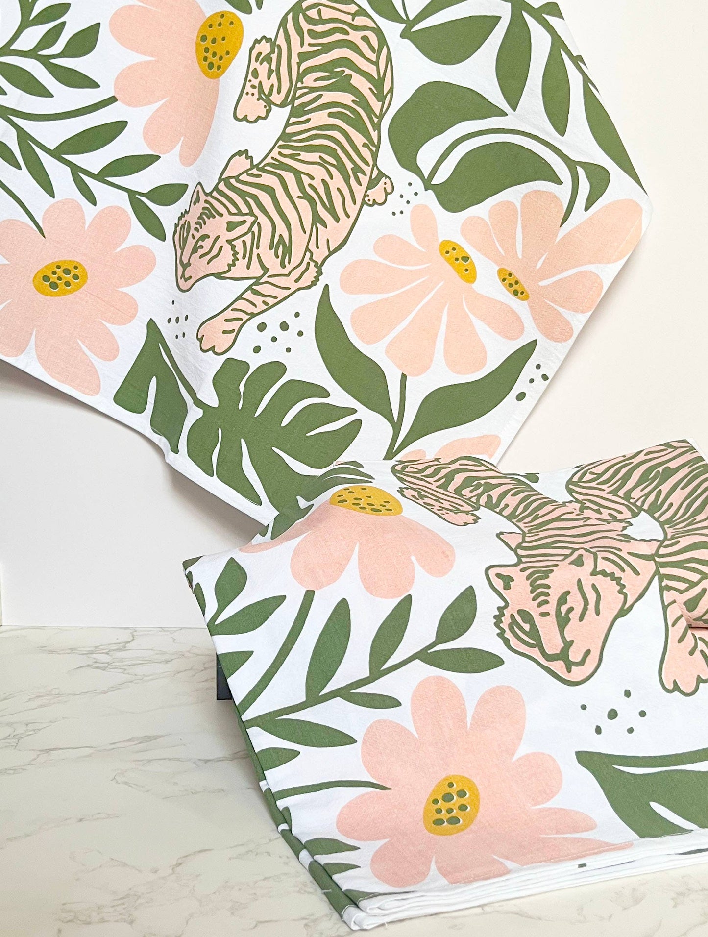 Tiger floral tea towel by The Coin Laundry featuring modern boho pink and green flower design for kitchen decor.
