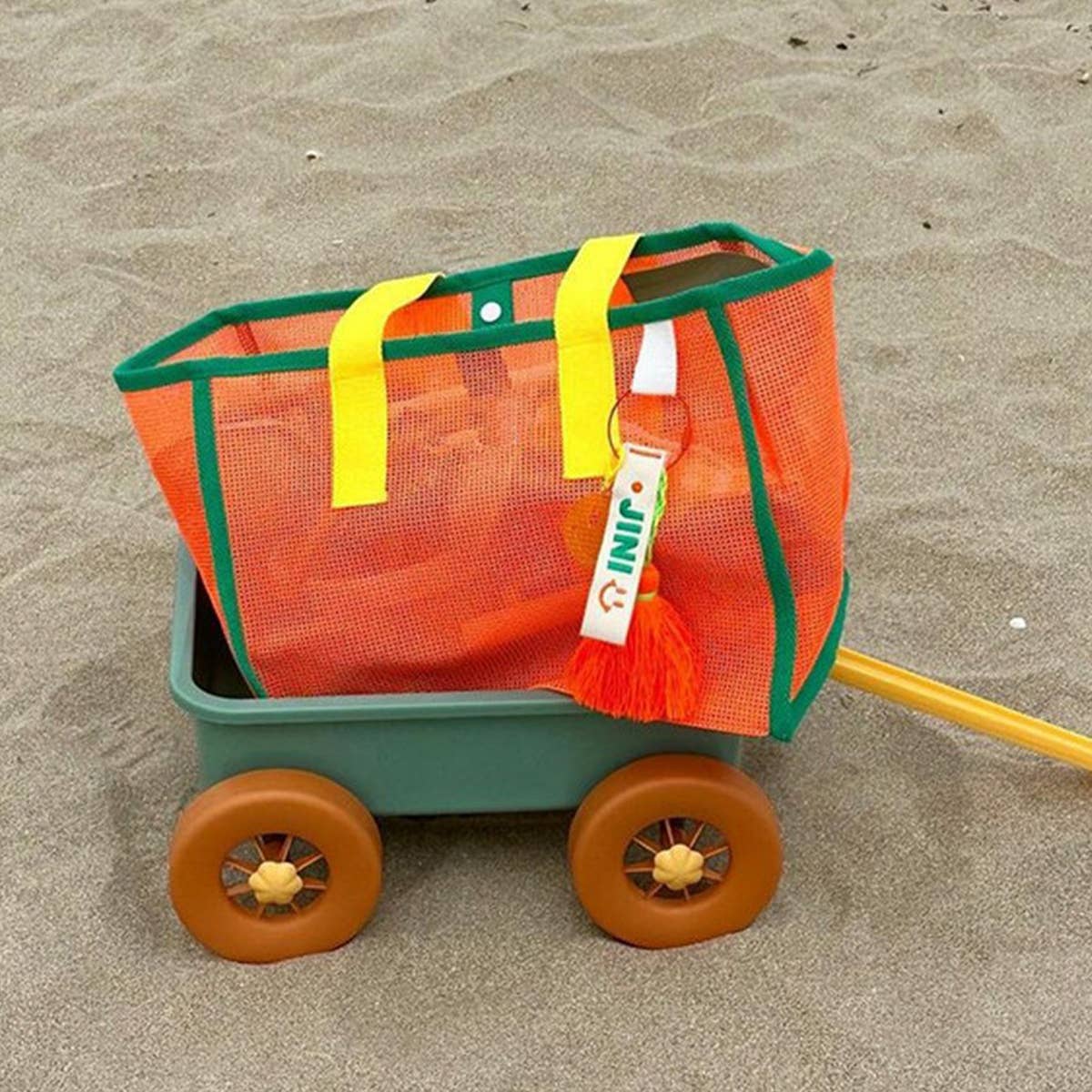 ACCITY mesh beach bag with breathable mesh design, sturdy handles, and spacious interior for carrying beach essentials.
