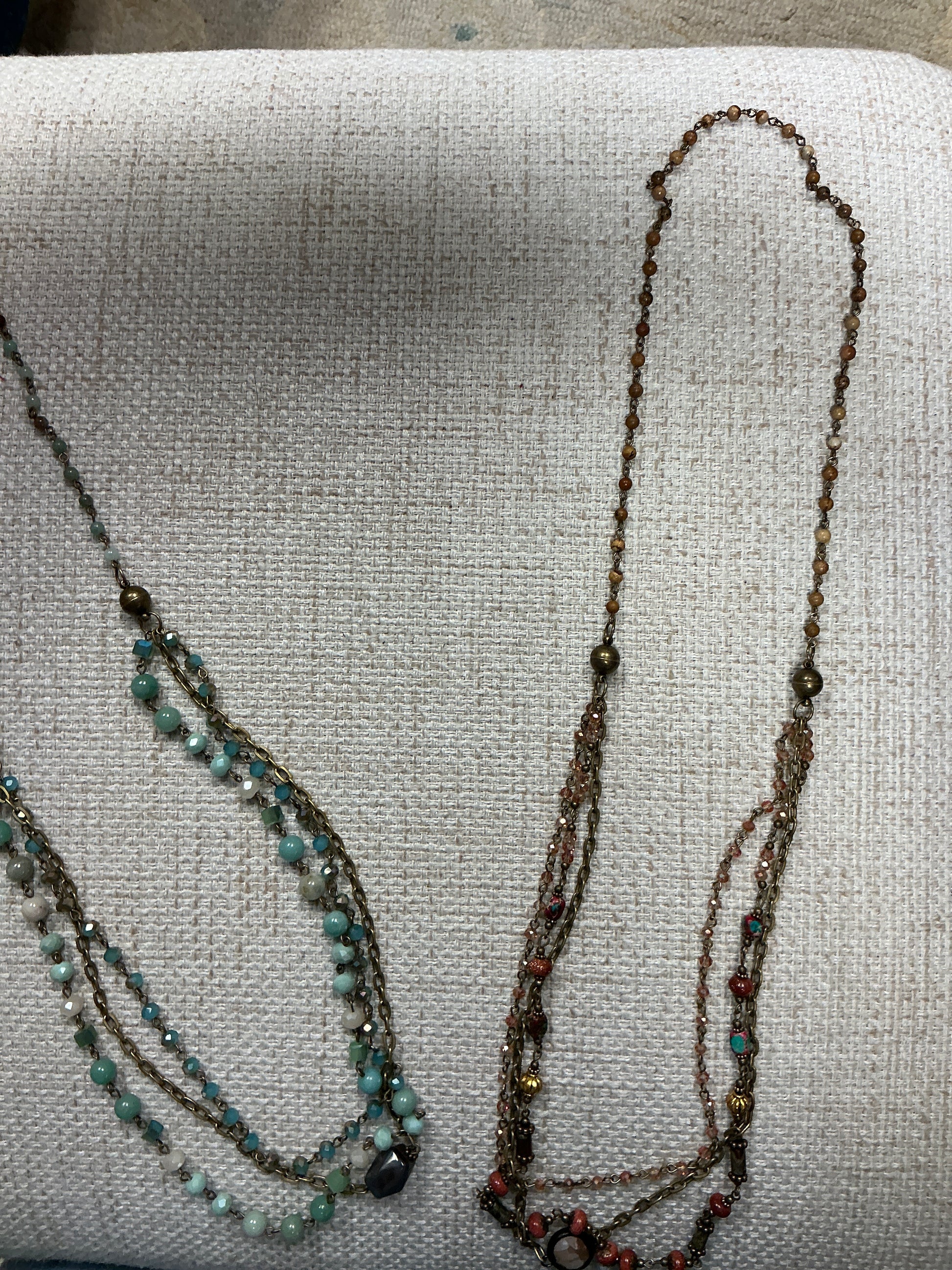 Beaded 2-in-1 necklace from American Unique Group featuring colorful beads and layered design.