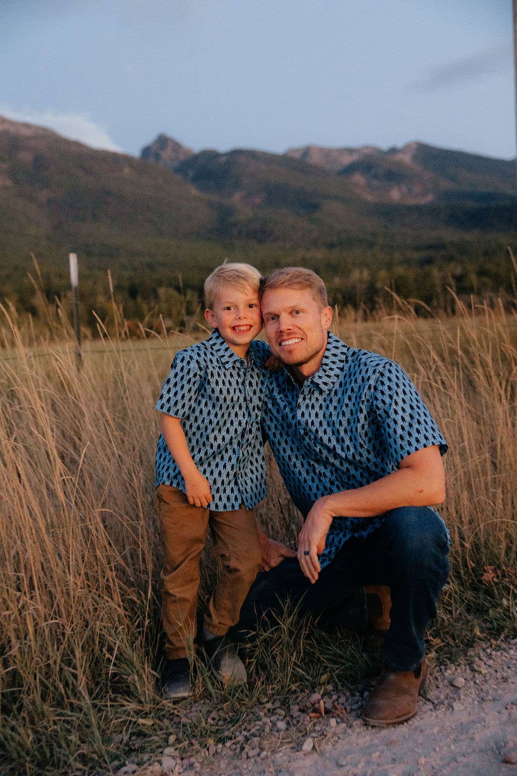 Hey Bear! men's button-down dress shirt by Made of Mountains, featuring a classic collar and plaid pattern in a close-up view.