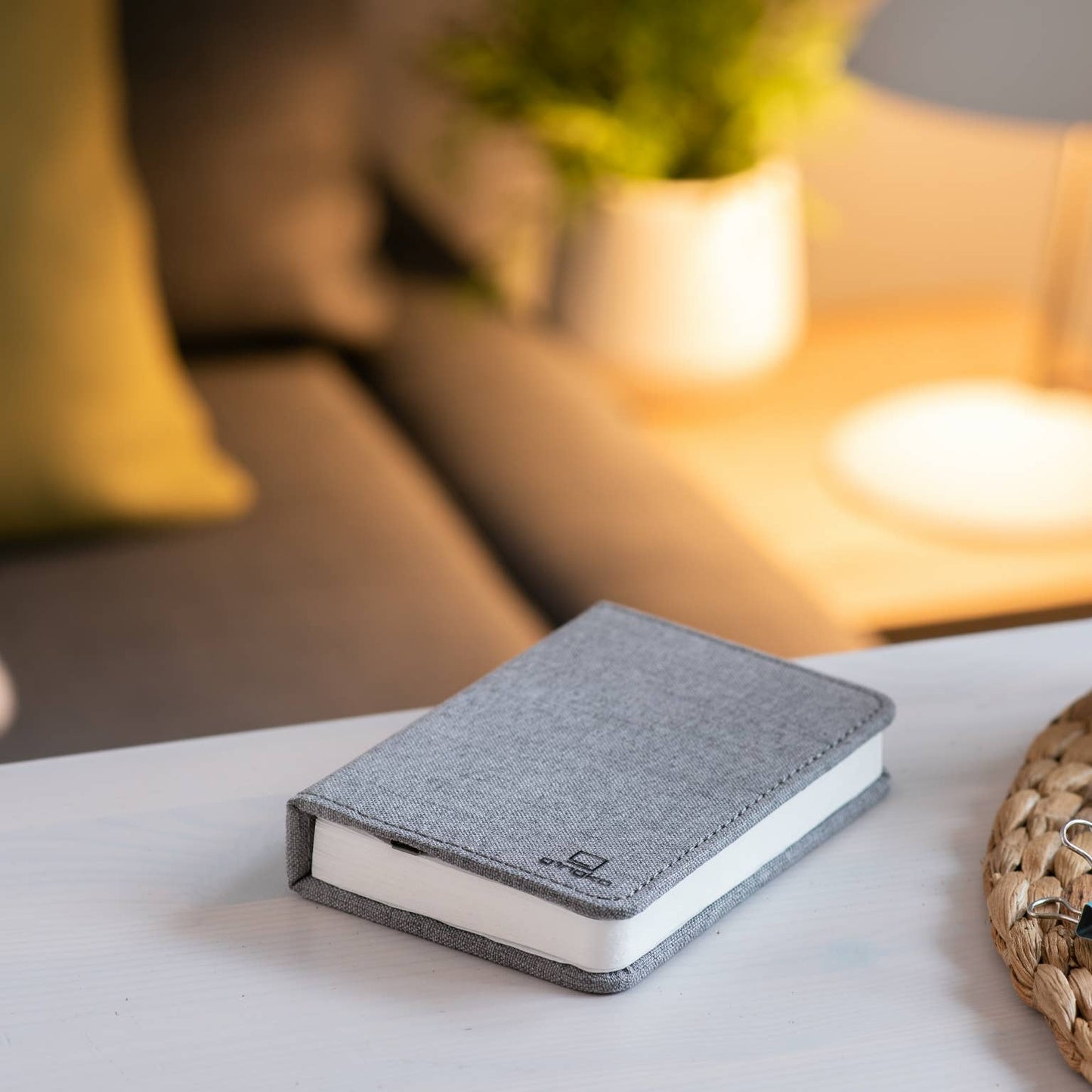 Gingko Design linen fabric smart book light lamp with soft glow, portable reading light for books or bedside use.