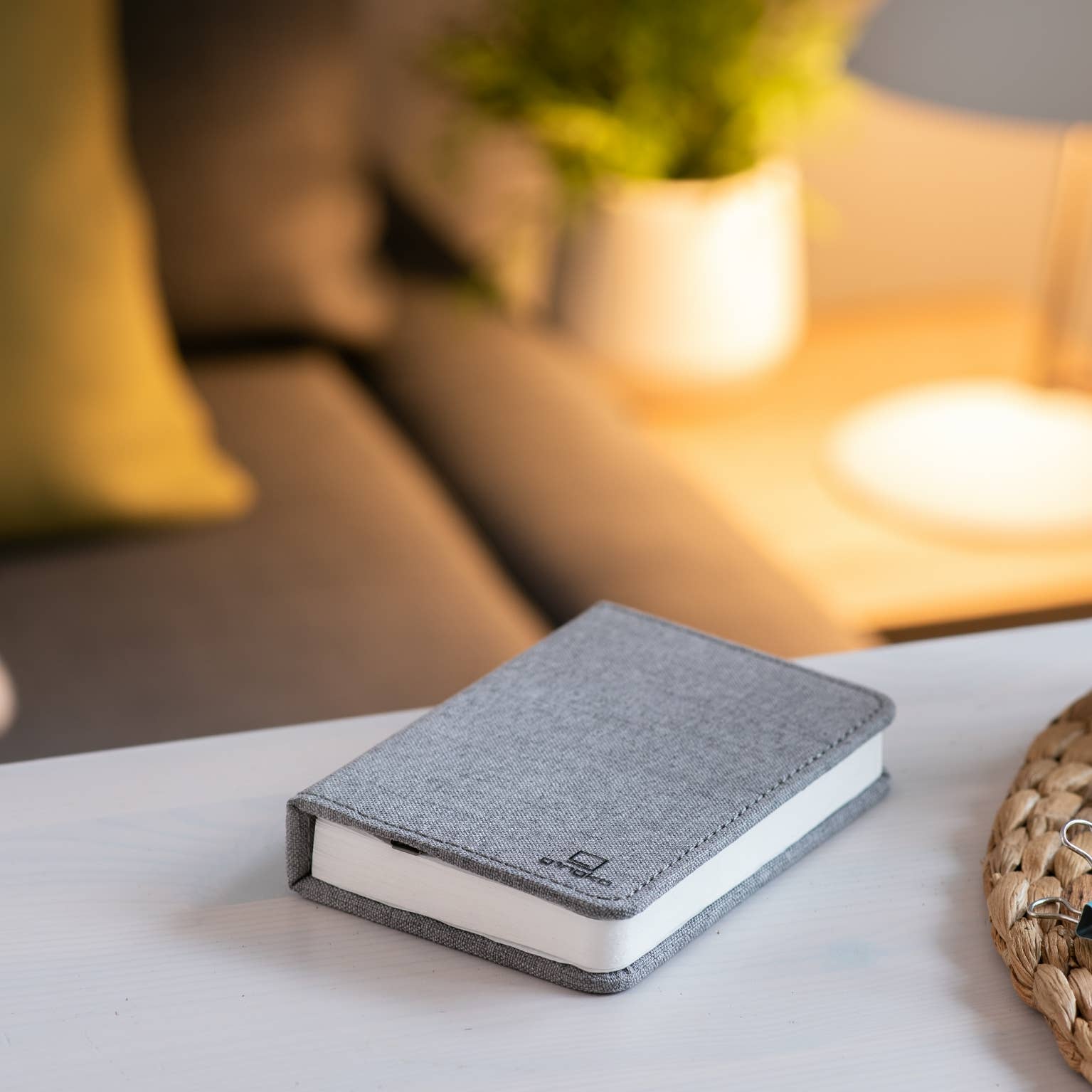 Gingko Design linen fabric smart book light lamp with soft glow, portable reading light for books or bedside use.
