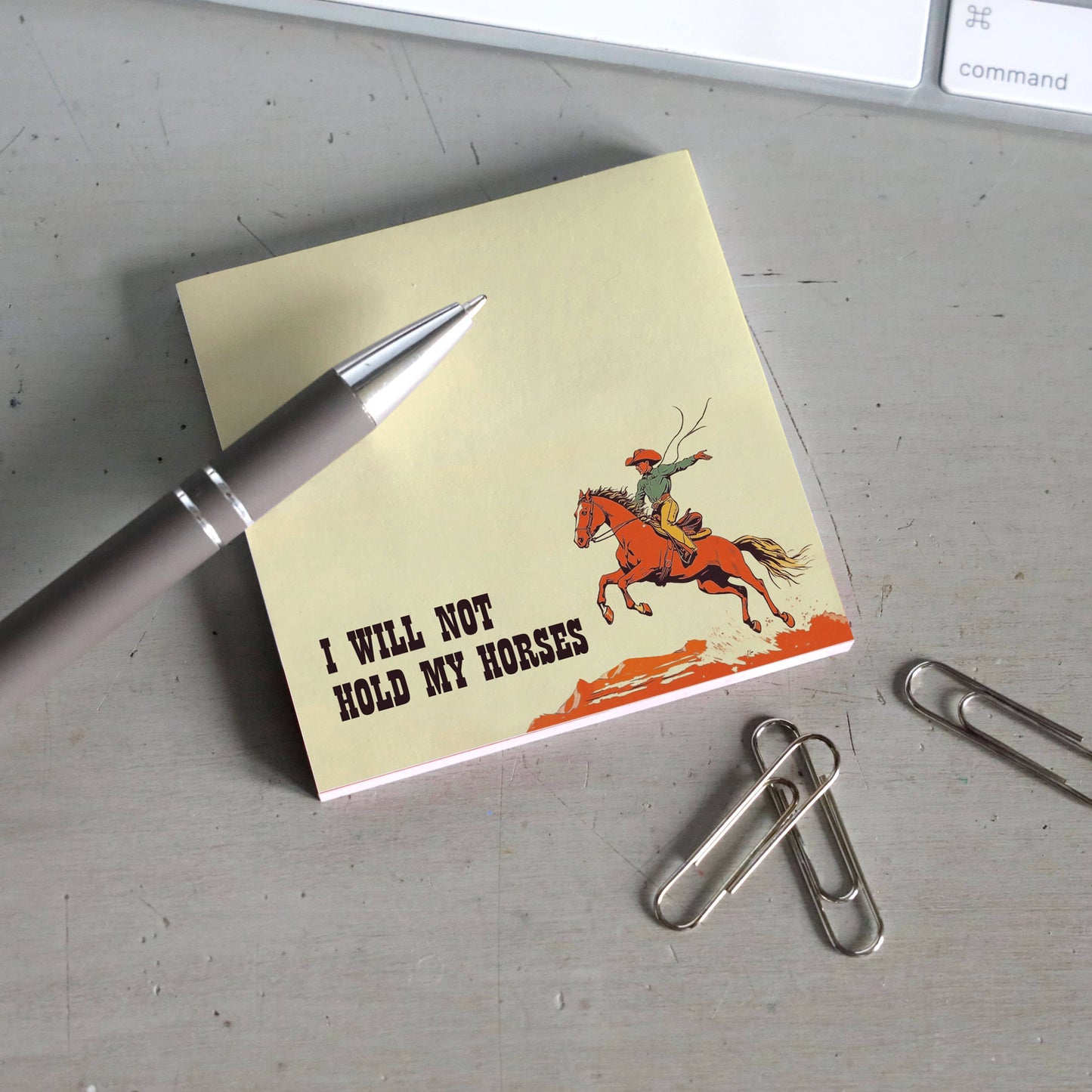 Sticky note pad from Bad Betty Greeting Co. featuring humorous "I Will Not Hold My Horses" design, with yellow notes and playful text.