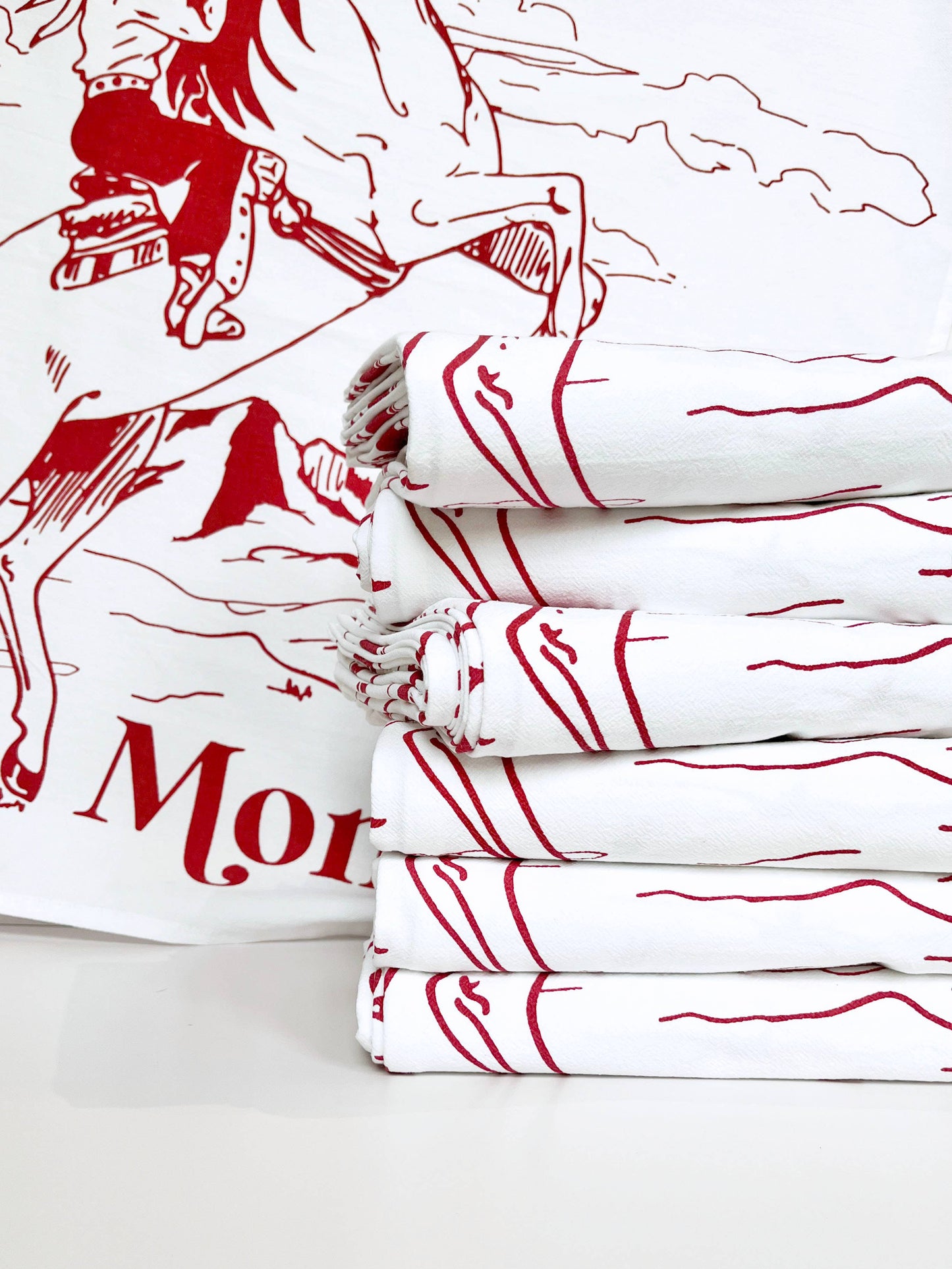 No Place Like Montana cowgirl kitchen towel by The Coin Laundry featuring a rustic western design and vibrant colors.