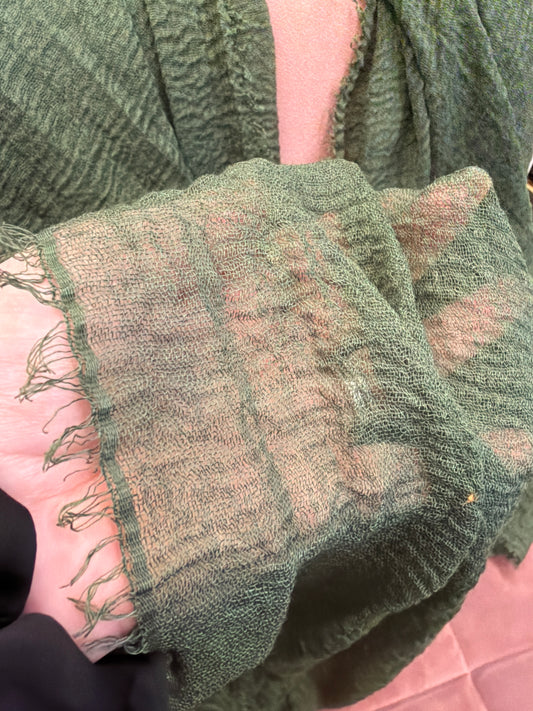 Joia tissue scarf featuring lightweight, soft fabric with a stylish pattern, perfect for adding a touch of elegance to outfits.