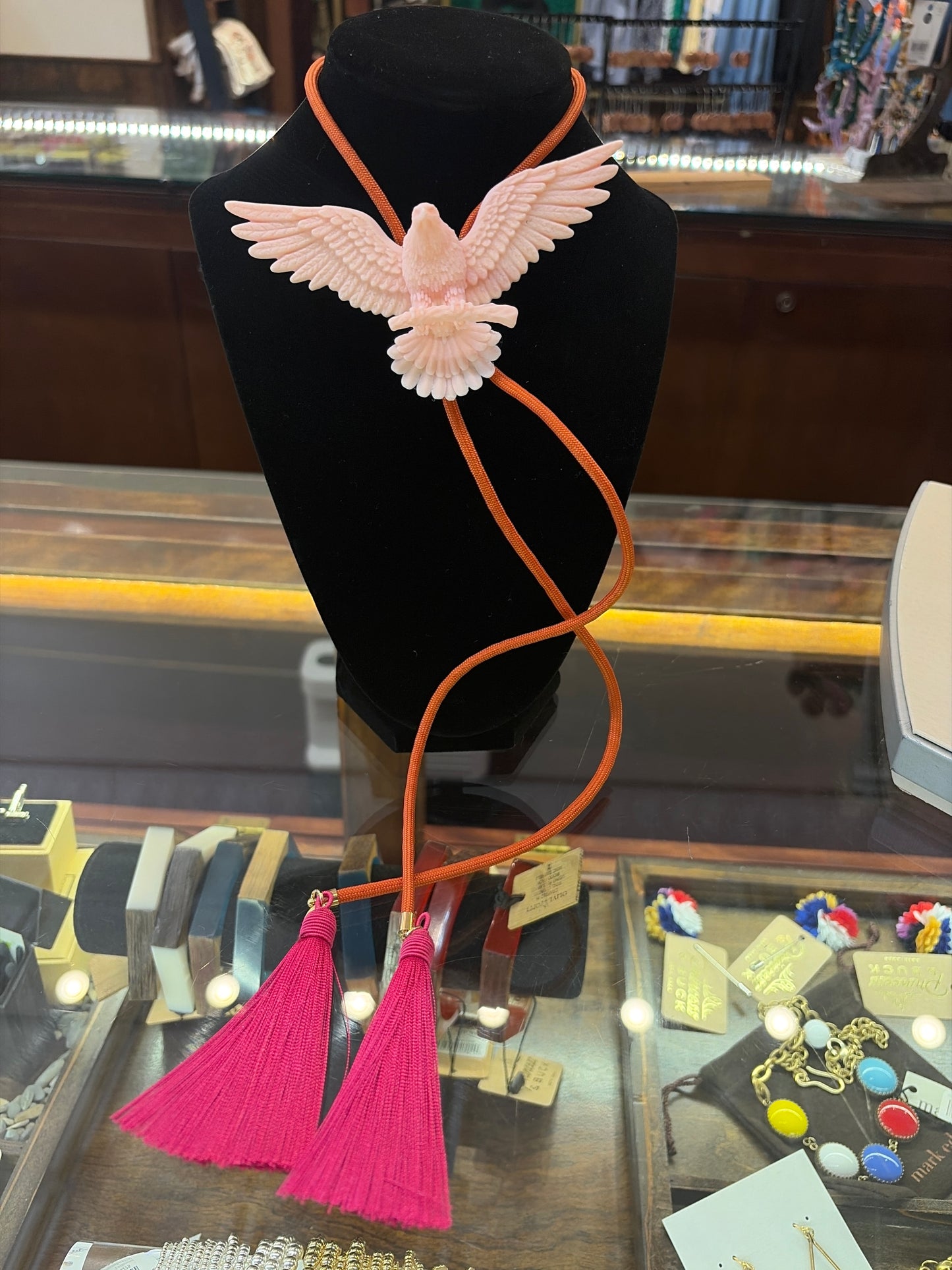Rahya Jewelry Design bolo tie necklace featuring a decorative cord and slide, stylish accessory for casual or formal wear.