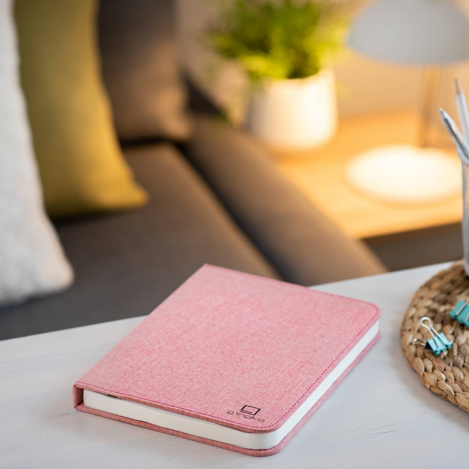 Gingko Design linen fabric smart book light lamp with soft beige linen cover and flexible reading arm, ideal for nighttime reading.